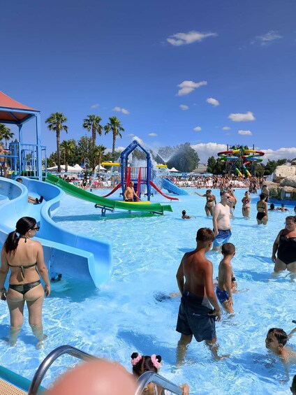 A water park with multiple slides and a wave pool. 5