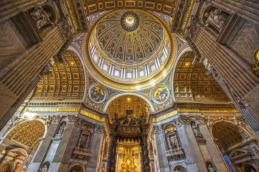 A grand, ornate interior with a large dome ceiling, intricate gold detailing, and classical columns. 5