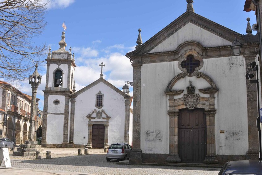 A historic church with a bell tower and a large arched entrance. 2
