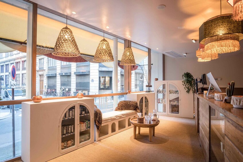 A modern interior with large windows, a seating area with a view, and decorative lighting. 1