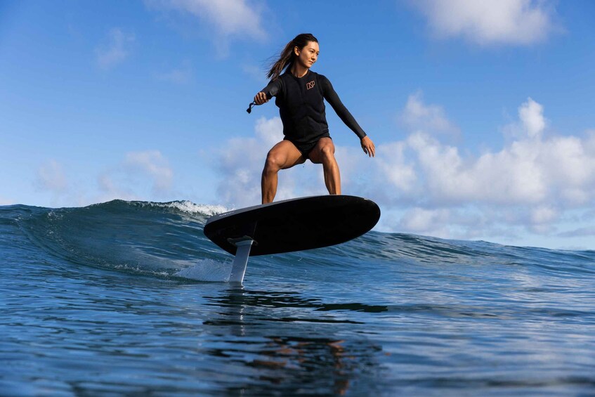 A person surfing on a wave. 2
