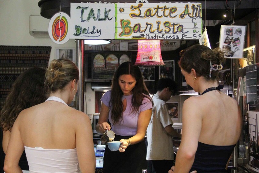 A food stall with a sign that reads 'Talk Daily' and 'Satte Art Barista.' 3