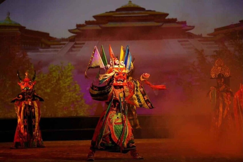 A traditional performance with actors in elaborate costumes and masks, set against a backdrop of a temple-like structure. 2