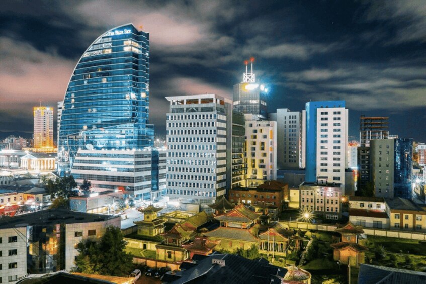A cityscape at night with modern skyscrapers and traditional architecture. 3