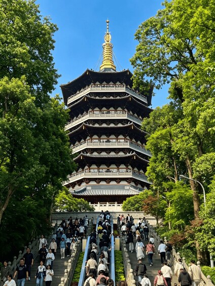 A traditional multi-tiered pagoda surrounded by lush greenery. 1