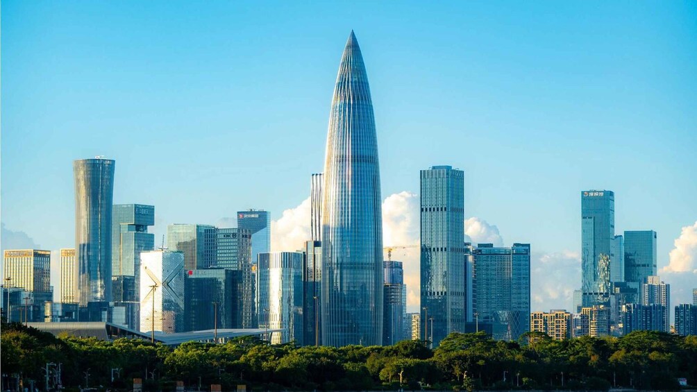 A city skyline with a prominent skyscraper in the center, surrounded by other high-rise buildings. 4