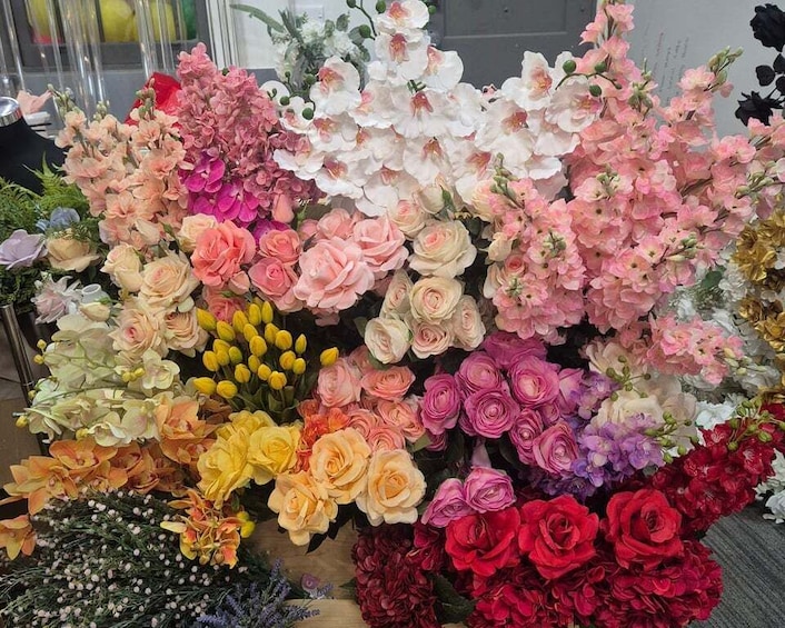 A variety of artificial flowers in different colors and types. 1