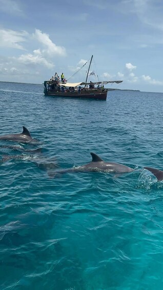A boat with people on it in the ocean. 2