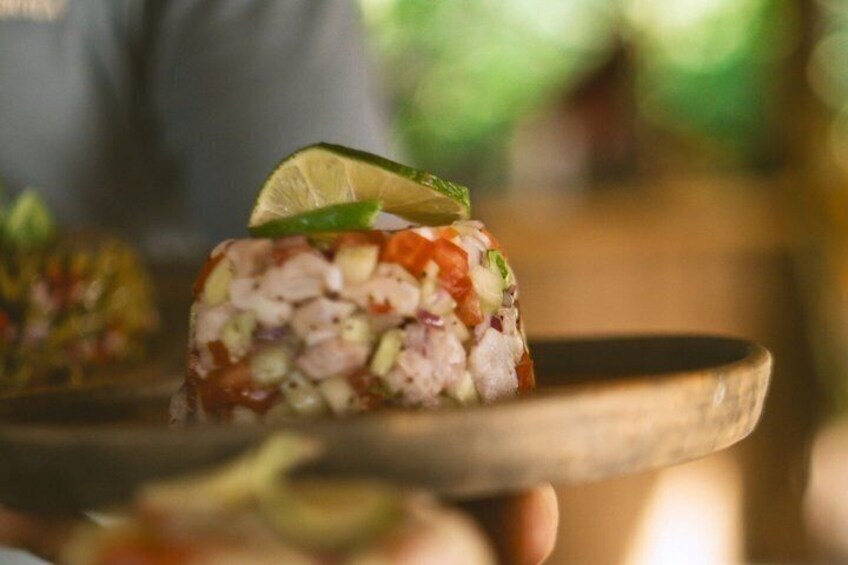 A sushi dish with a lime wedge garnish. 4