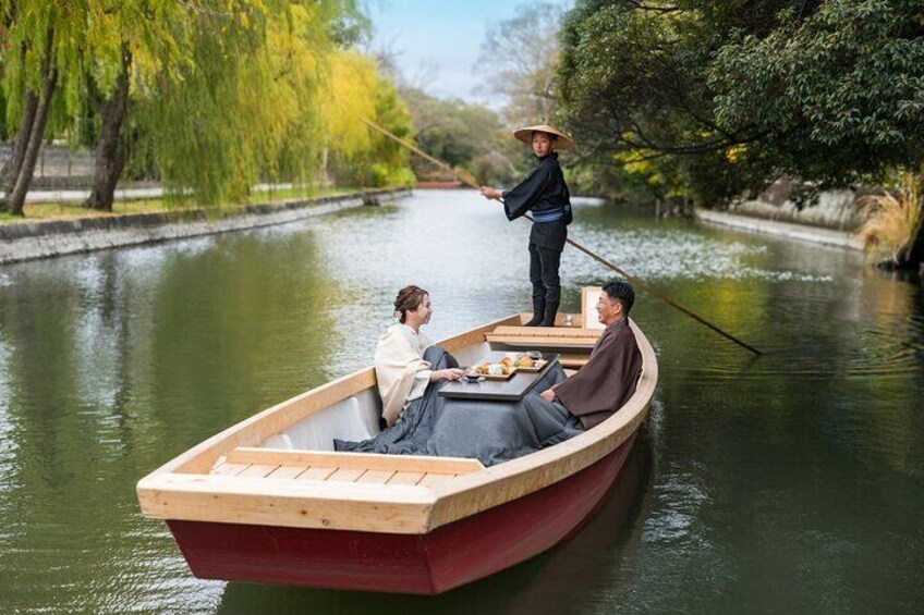 A wooden boat on a calm river with trees on the banks. 3