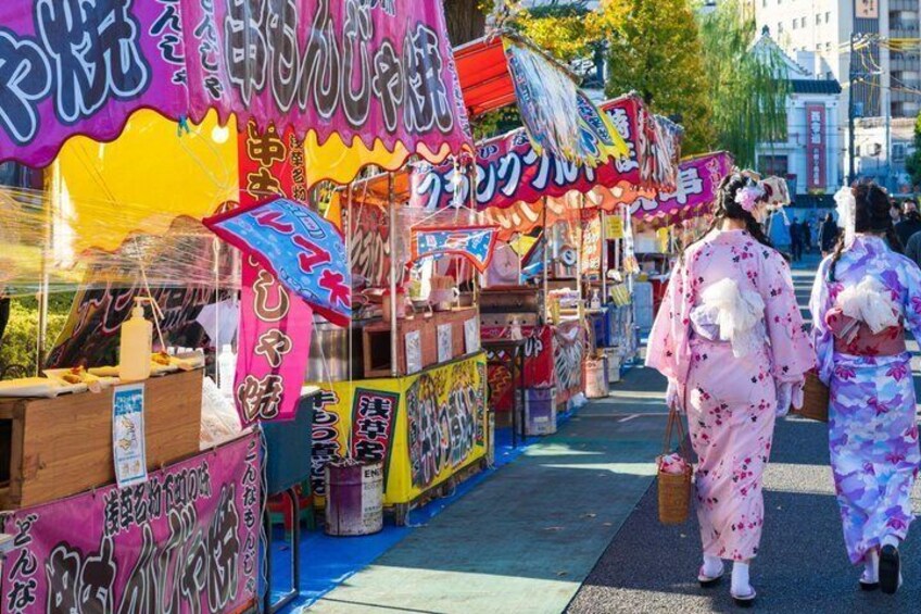 A street market with colorful stalls and traditional Japanese attire. 3