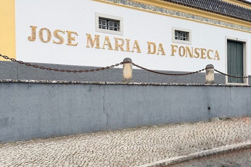 A building with the name 'JOSE MARIA DA FONSECA' in gold lettering. 2