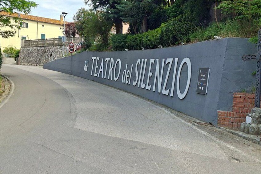 A road leading to Teatro del Silenzio with a speed limit sign. 3