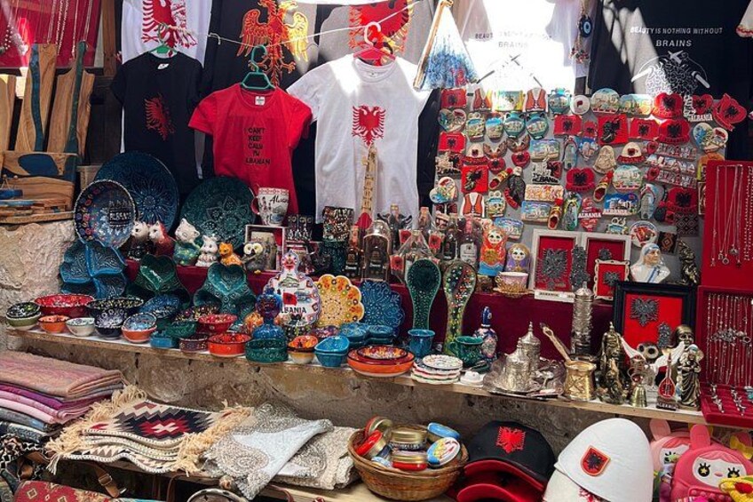 A variety of colorful textiles and accessories displayed at a market stall. 5