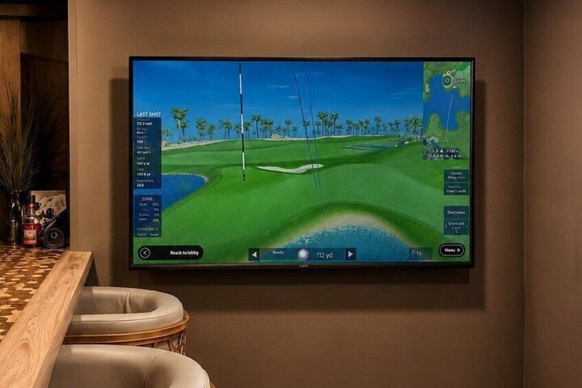 A golf video game on a large screen. 2