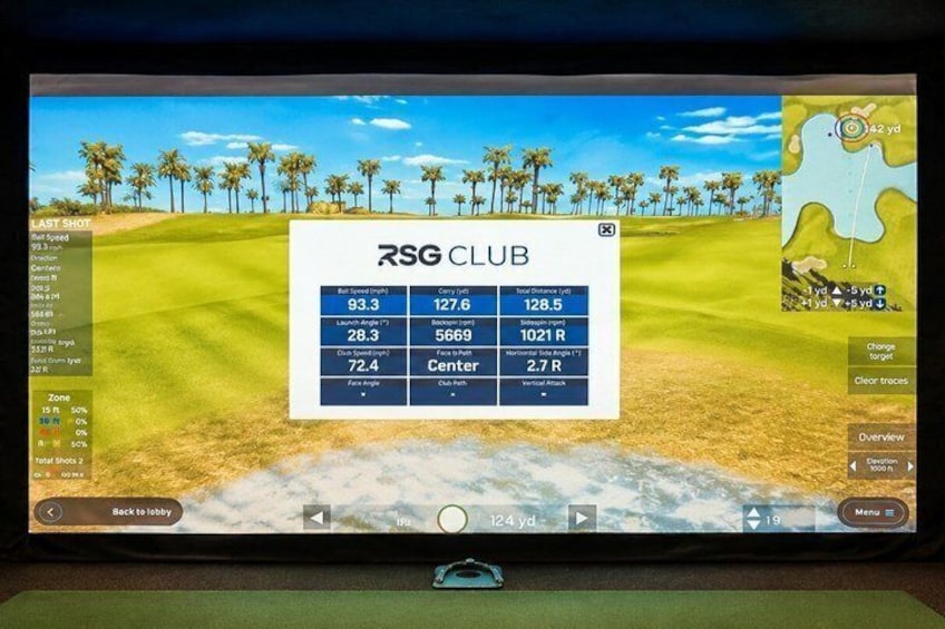 A golf course with a screen displaying shot statistics. 1