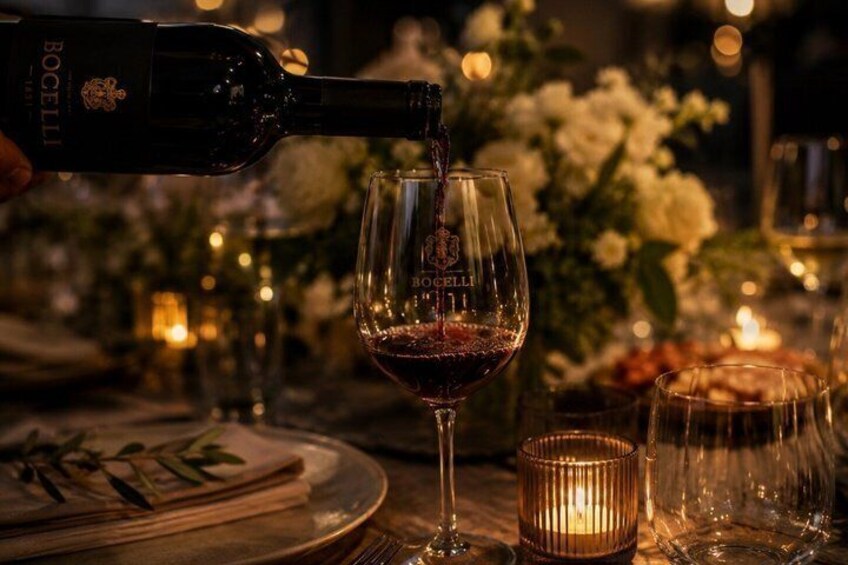 A bottle of Bocelli wine being poured into a glass. 3