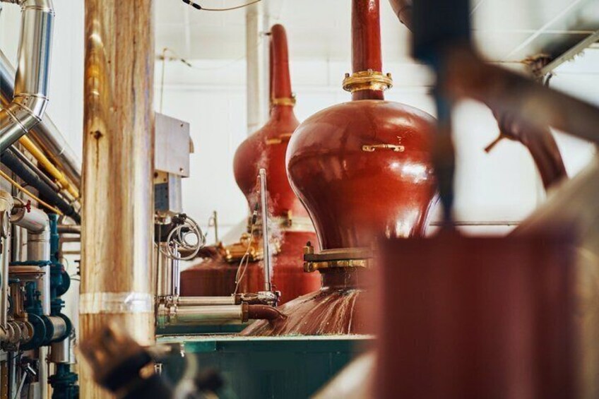 Industrial equipment, including large red tanks and pipes. 5