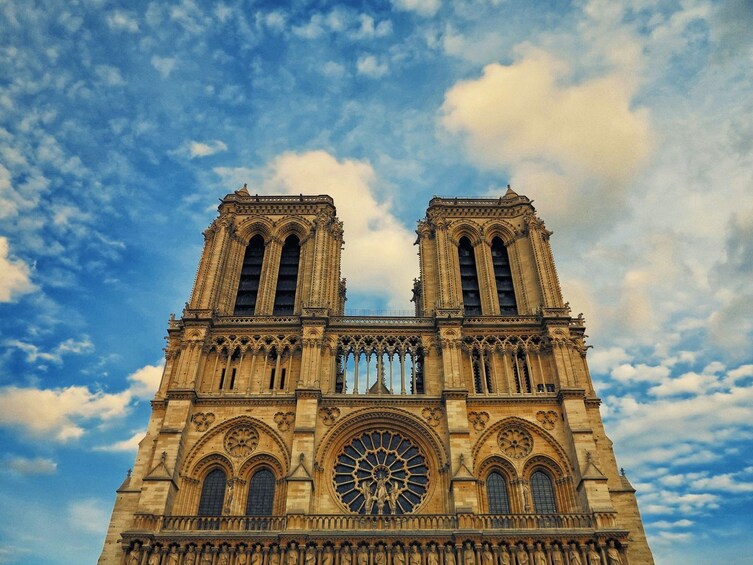 A Gothic cathedral with twin towers and a large rose window. 4