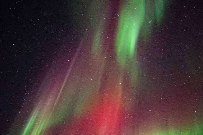 The aurora borealis with green and red hues. 4