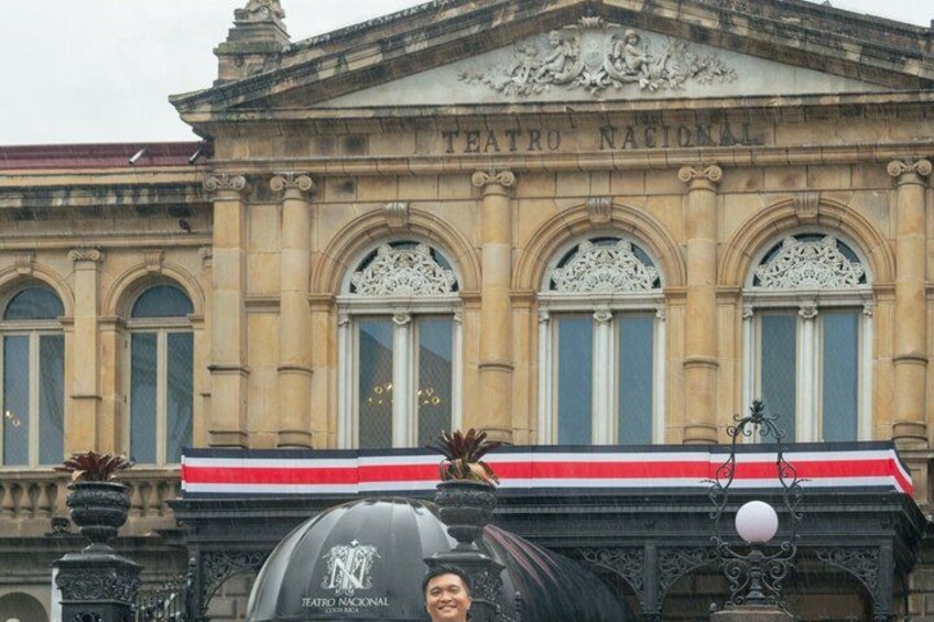 Teatro Nacional with ornate architecture and a red awning. 3