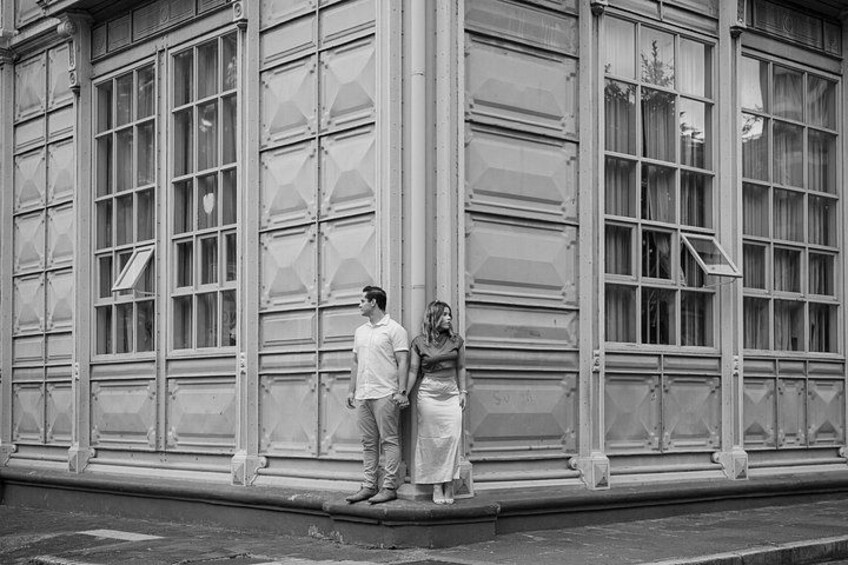 A man and a woman standing in front of a large garage door. 5