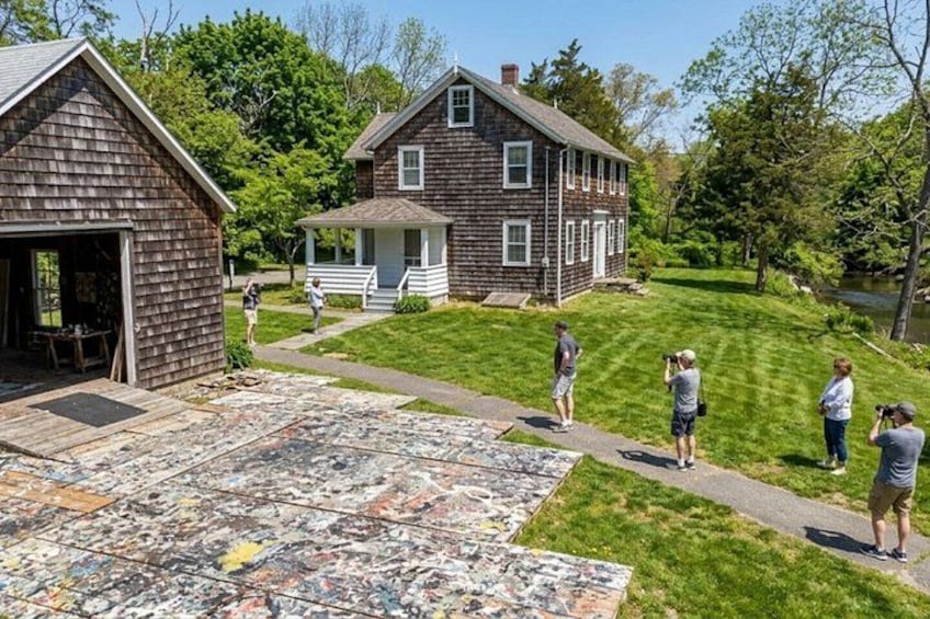 A residential area with a house, a garage, and a lawn. 3