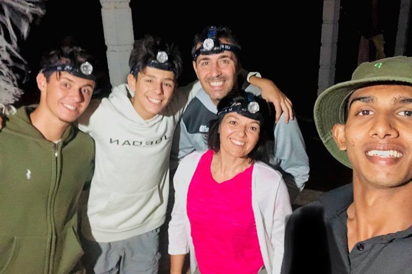 A group of people outdoors at night. 2