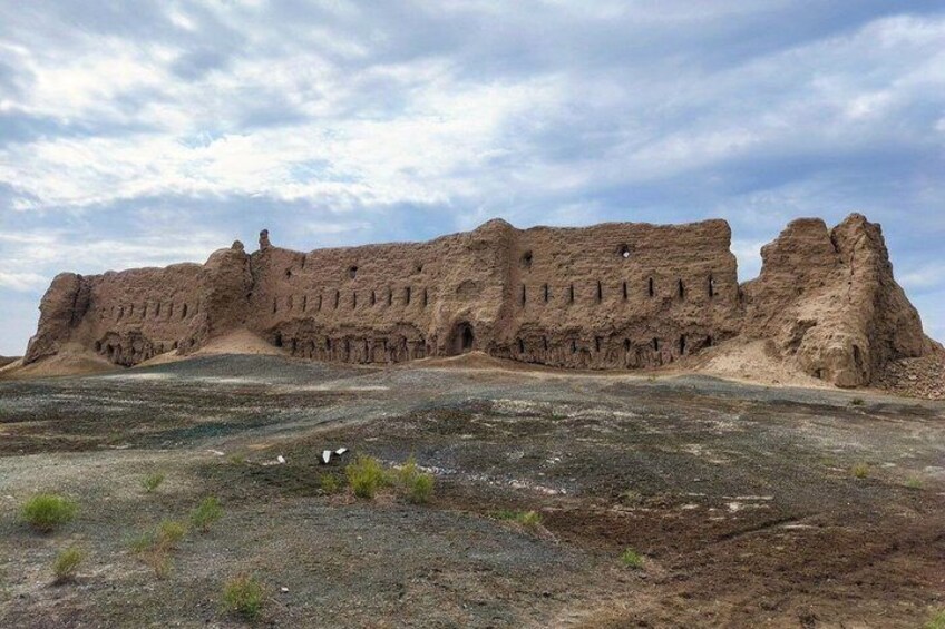 A large, ancient ruin with multiple arches and a flat-topped structure. 5