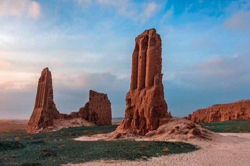 A desert landscape with prominent rock formations. 3