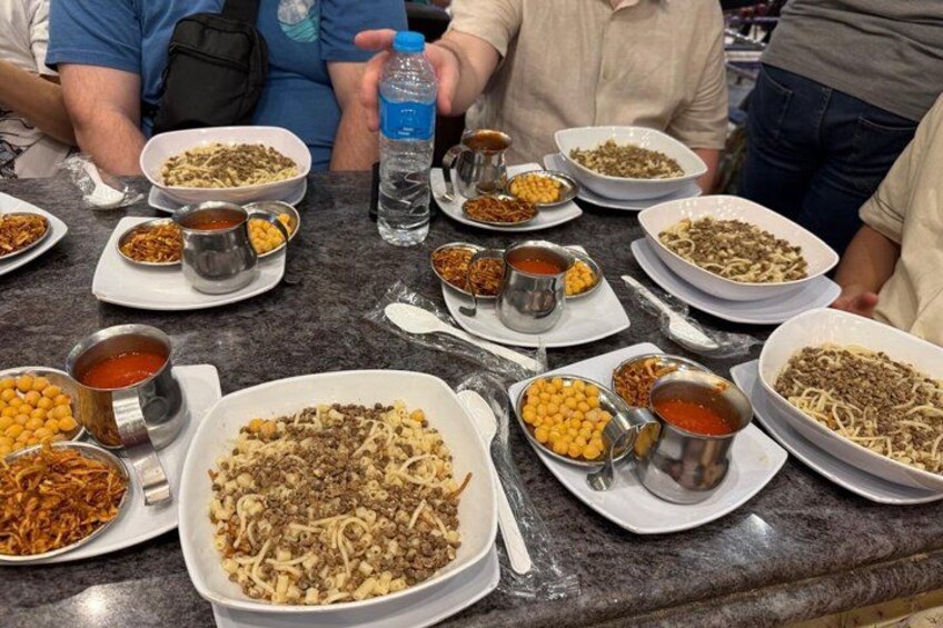 A table with various dishes and condiments. 3