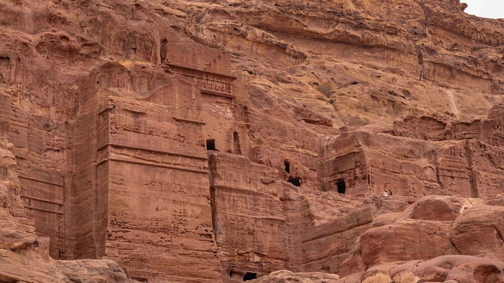 Ancient rock-cut architecture with multiple niches and passageways. 4