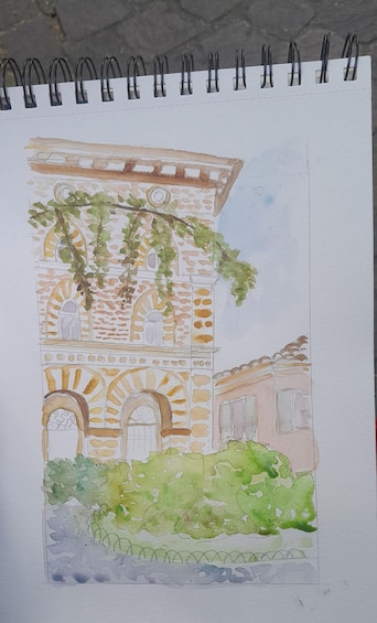 A watercolor sketch of a building with arches and a garden. 3
