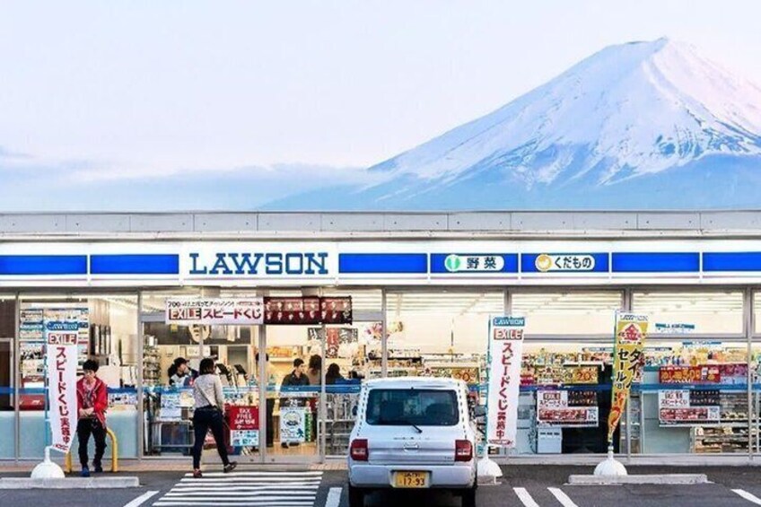 A Lawson convenience store with a mountain in the background. 2