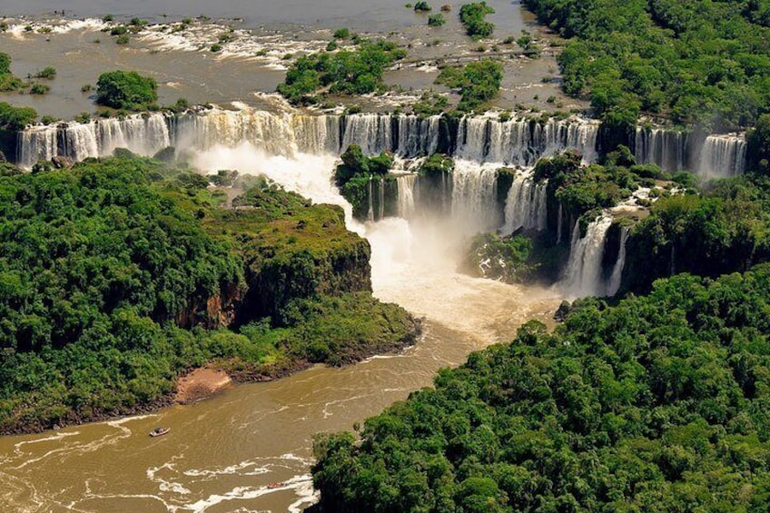A multi-tiered waterfall surrounded by dense greenery. 4