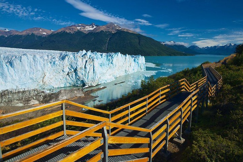A glacier, a lake, and a wooden walkway. 3