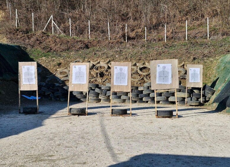 A shooting range with targets mounted on stands. 2