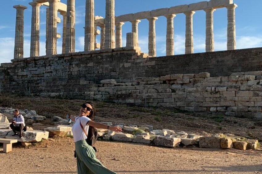 Ancient ruins with columns and stone structures. 1