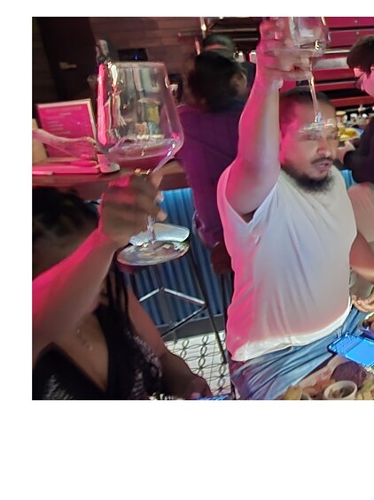 A group of people toasting with wine glasses. 5