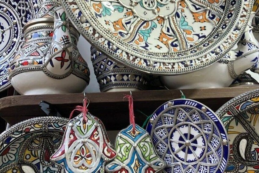 A collection of intricately designed ceramic plates and bowls. 2
