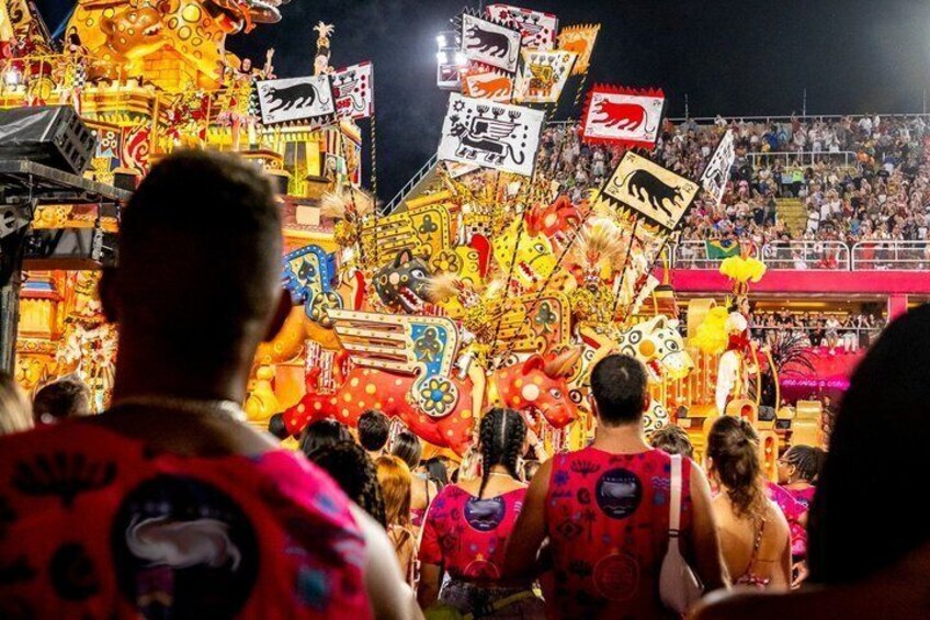 A vibrant carnival with colorful decorations and a crowd of people. 5