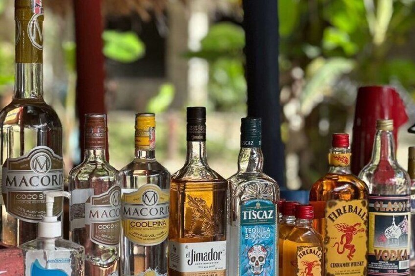 A variety of liquor bottles on display. 4