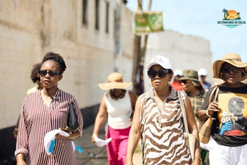 People walking on a street with buildings in the background. 2