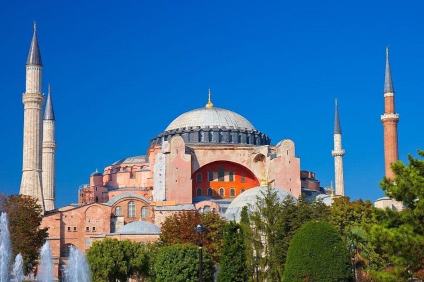 A historic building with a large dome and multiple minarets. 3