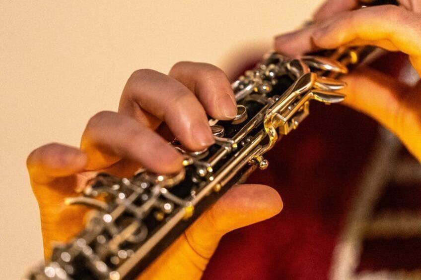A person playing a clarinet. 2