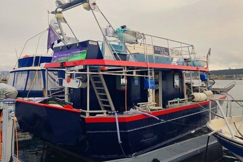 A fishing boat named 'Jenny Green' docked at a marina. 3