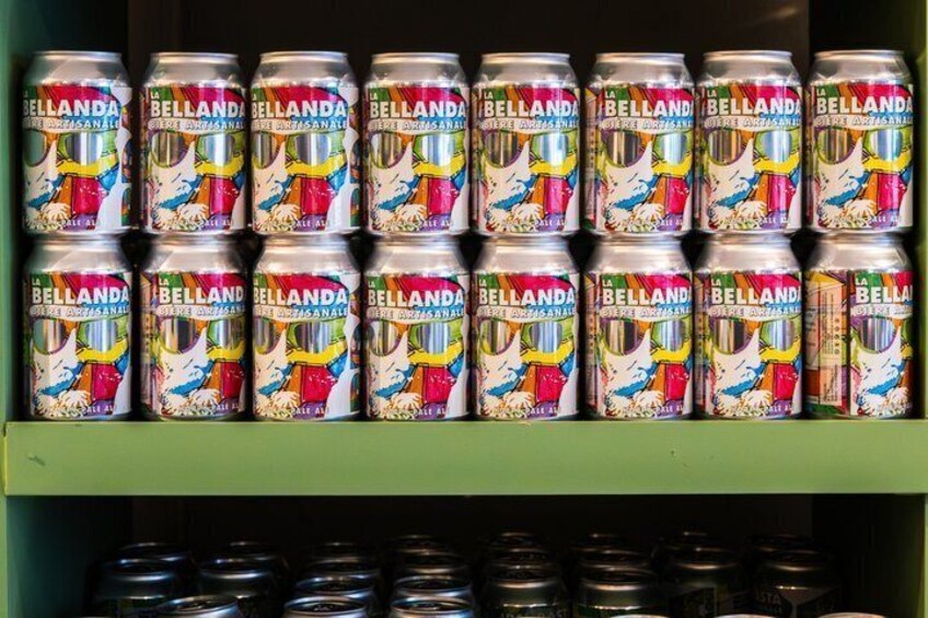 A shelf with multiple cans of Bellanda beer. 3