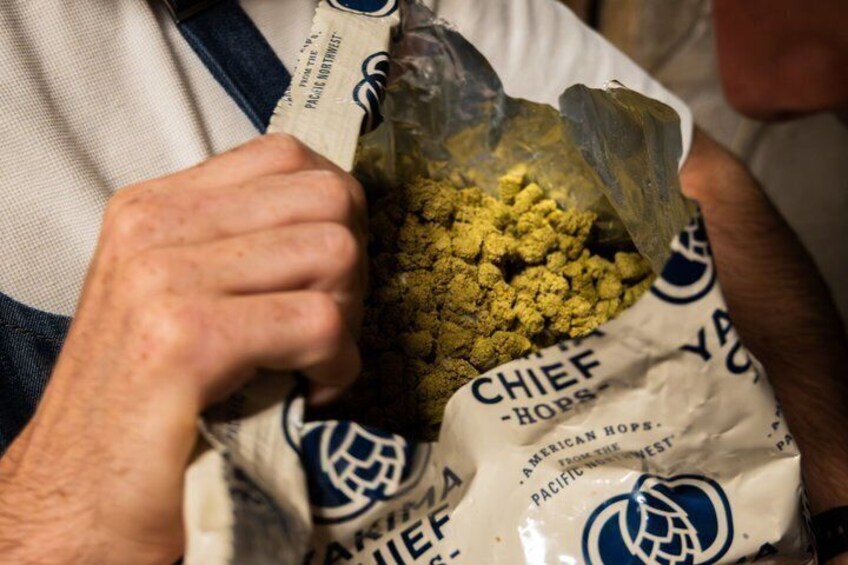 A person holding a bag labeled 'CHIEF CHOPSTICKS' with a logo and text indicating it's from the Pacific Northwest. 5