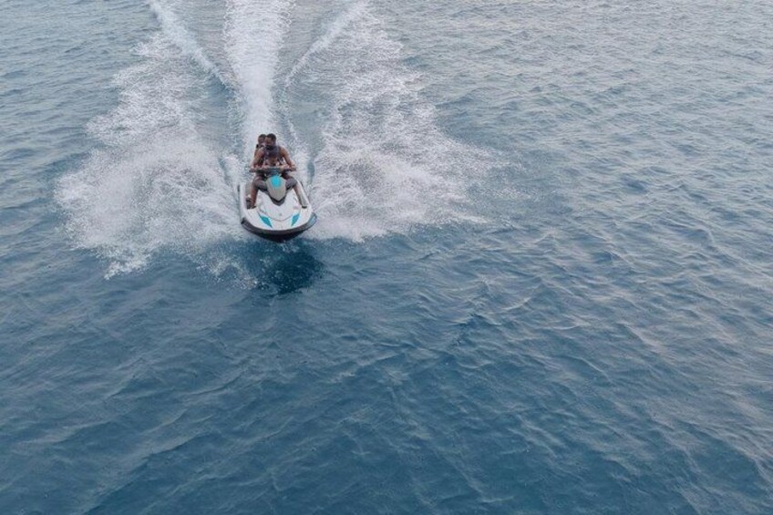 A person jet-skiing on a large body of water. 2