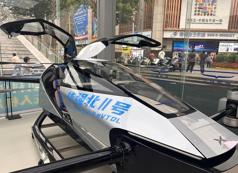 A futuristic vehicle with a sleek design, parked on a sidewalk with a cityscape in the background. 4
